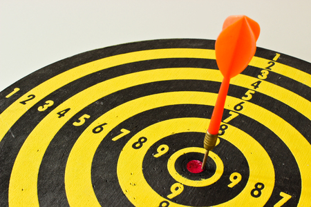 The Dartboard with the Red Dartの写真素材