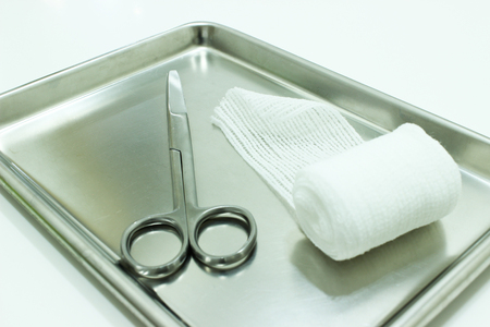 Elastic Gauze and Scissors on the Stainless Steel Trayの写真素材