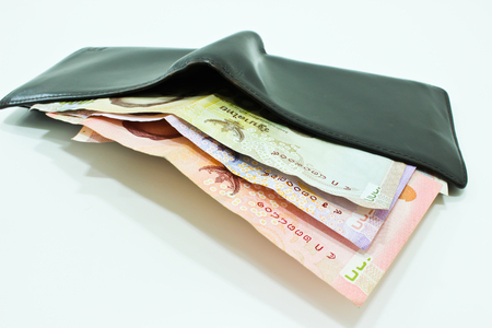 Wallet with Thai Banknote Isolated on the White Backgroundの写真素材