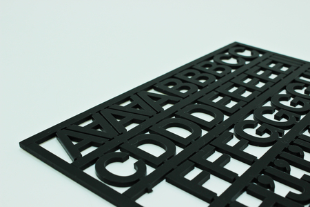 The Black Color Alphabets Isolated on the White Background
