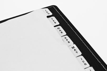 Monthly Filing Sheets in the Ring Binder Isolated on the White Backgroundの写真素材