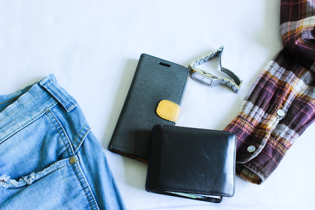 Jeans, Shirt, Wallet, Smart phone and Watch Isolated on the White Background