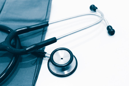 Stethoscope on Green Fabric Isolated on the White Backgroundの写真素材