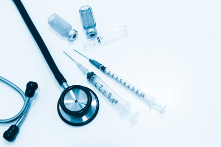 Stethoscope, Ampule and Vial of Drugs, 3 and 1 ml Plastic Syringe with Needle Isolated on the White Backgroundの写真素材