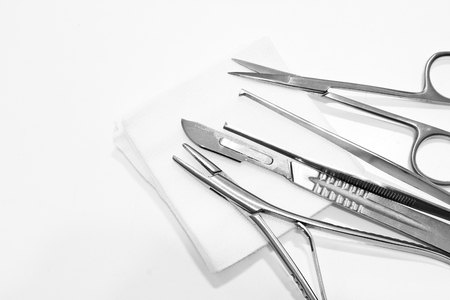 Needle Holder, Scalpel,Scissors, Forceps and Gauze  isolated on the white backgroundの写真素材