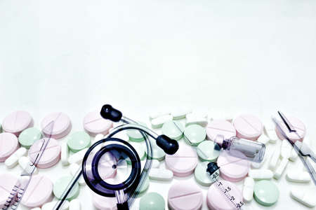 The Surgical Instruments, Stethoscope, Vial of Drug, 3 ml Plastic Syringe with Needle and drug tablet with blank space on the topの写真素材