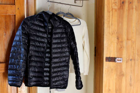 Black jacket hanging on the cloth rack