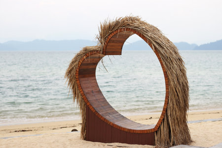 Heart shaped seat on the beachの写真素材