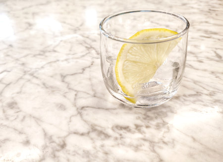 Lemon cut and ice in glassの写真素材