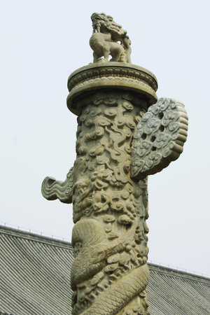 Figurine on the pillarの写真素材