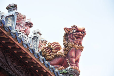Close up view of sculptures on the roof top of an ancient building