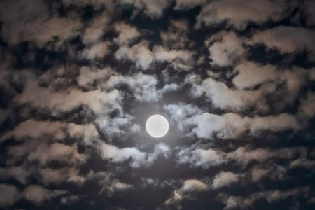 Moon in the sky with cloudsの写真素材