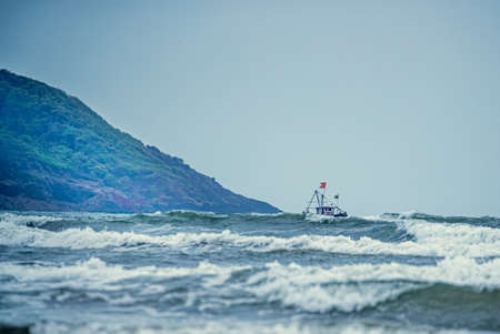 Fishing Ship sailing in sea for fishes