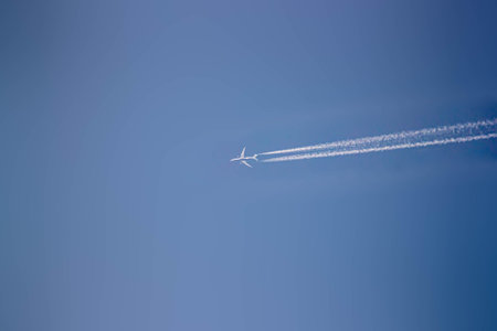 A plane leaving smoke on routeの写真素材
