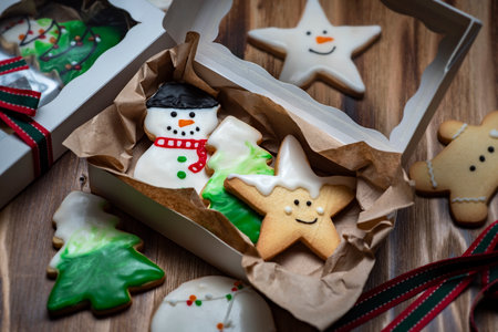 Christmas gingerbread cookies in a gift box on a wooden background.の写真素材