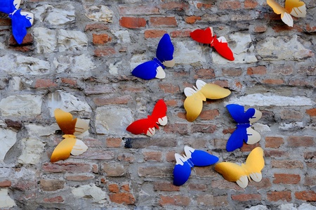 Butterflies shapes on medieval wall  Spontaneous street art の写真素材