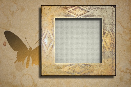 Worn marble frame and butterflyの写真素材