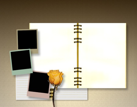 Open diary book or  album with instant images and dry roseの写真素材