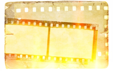 Vintage film strip frame on old paper background. Flames and fire light effect.の写真素材