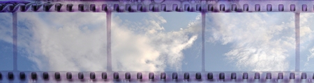 Vintage film strip frame with clear cloudy skyの写真素材