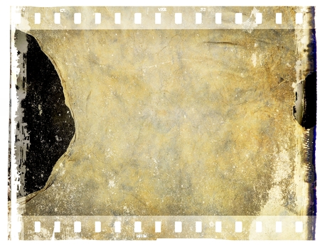 Vintage film strip frame with ruined leather texture. Tones of sepia.の写真素材