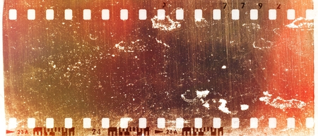 Grunge scratched red film strip frame. Design element.の写真素材
