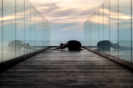 practise yoga, Child's pose at the hotel in early morning.の写真素材