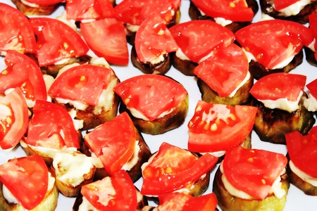 Fried eggplant with tomatoesの写真素材