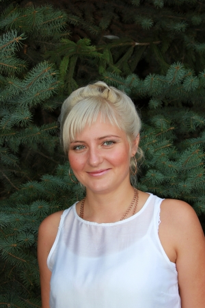 Portrait of a cute blonde near Spruceの写真素材