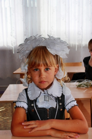 Primary school pupil sitting at a deskの写真素材