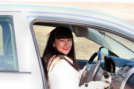Brunette in the car ignition key insertsの写真素材