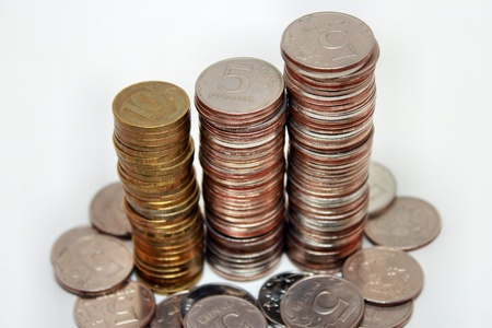 Coins on white background, stackedの写真素材