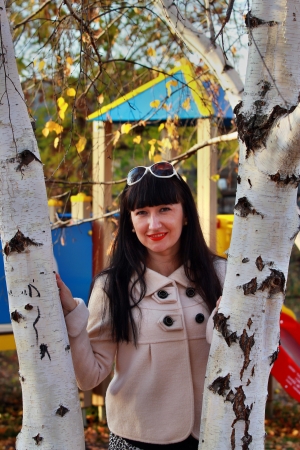 Portrait of a smiling girl against the playgroundの写真素材