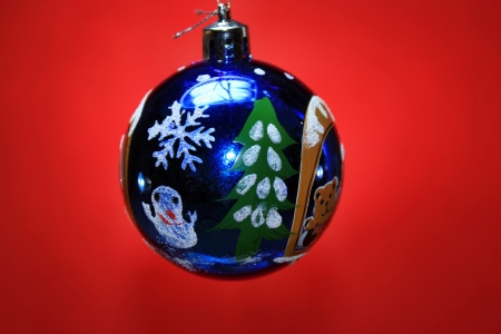 Blue ball on a red backgroundの写真素材