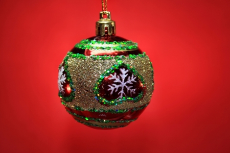 Christmas ball on a red backgroundの写真素材
