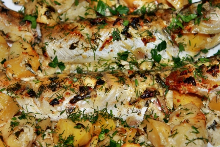 Walleye fish fried with potatoes on a plate close-upの写真素材