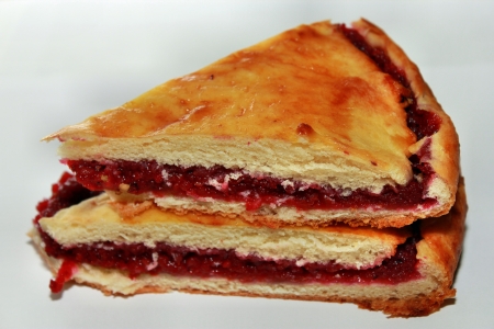Two pieces of sweet cake with strawberry fillingの写真素材