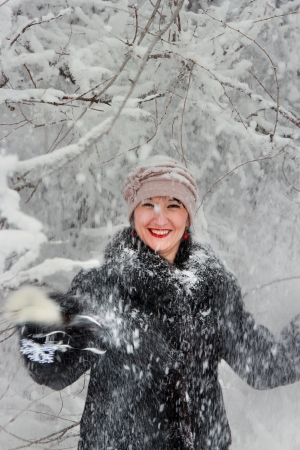 Girl in winter forest, snow-covered tree branches tresetの写真素材