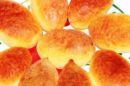 Roasted pies with cabbage and meat on a plateの写真素材