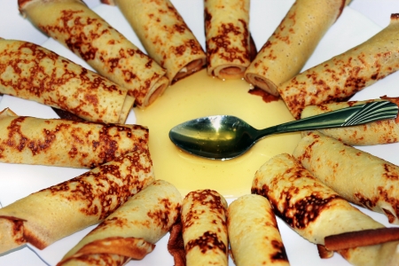 Rolled pancakes with honeyの写真素材