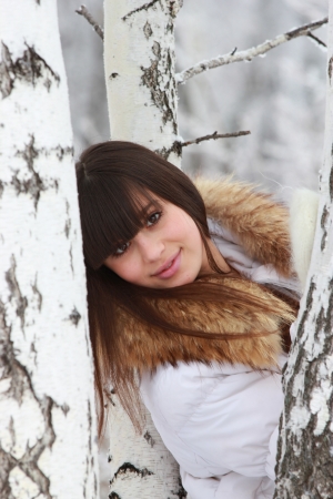 Portrait of a beautiful girl near the birchの写真素材