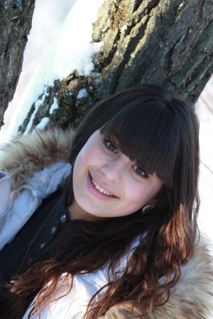 Winter portrait of smiling beautiful brunetteの写真素材