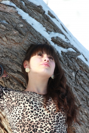Dreaming girl near the treeの写真素材