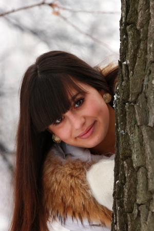 Portrait of a smiling girl near the treeの写真素材