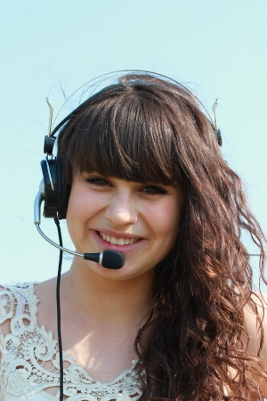 Portrait of happy girl in headphones with mikrafonの写真素材