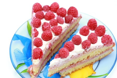 Slices of cake with raspberries on a plateの写真素材