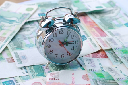 Alarm clock and moneyの写真素材