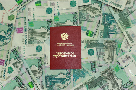 Pension certificate on the background of Russian money の写真素材
