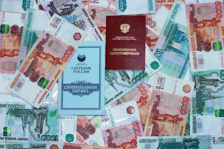 Pension certificate, savings book on the background of the Russian moneyの写真素材