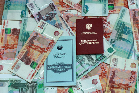Pension certificate, savings book on the background of the Russian moneyの写真素材